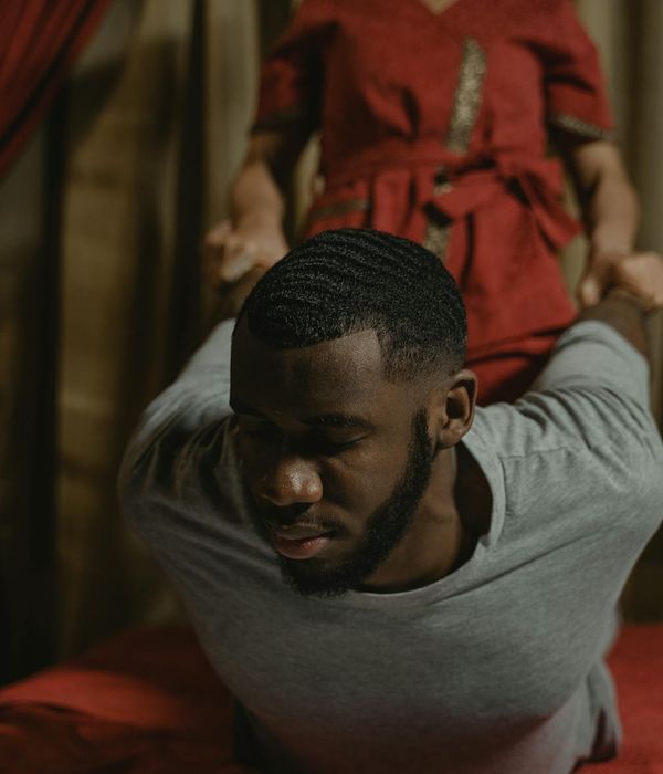 Person practicing gentle relaxation techniques for eyes outdoors